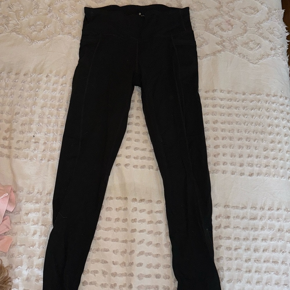 Athleta lined black running or exercise leggings, size medium